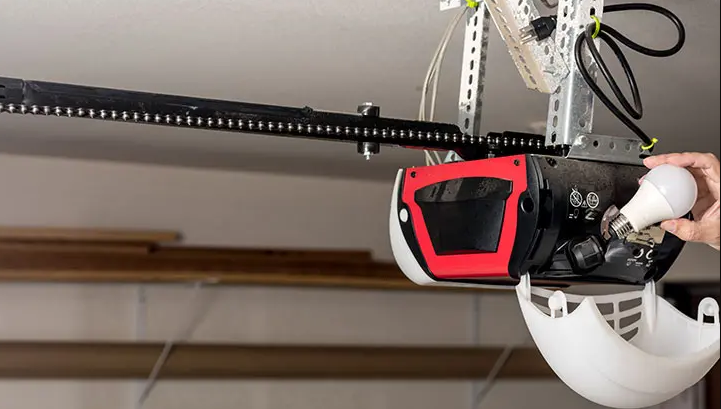 Image showing a professional technician repairing a garage door opener, highlighting the Orlando FL Quick Garage Door and Gate Repair service, specializing in efficient and reliable garage door opener repairs.