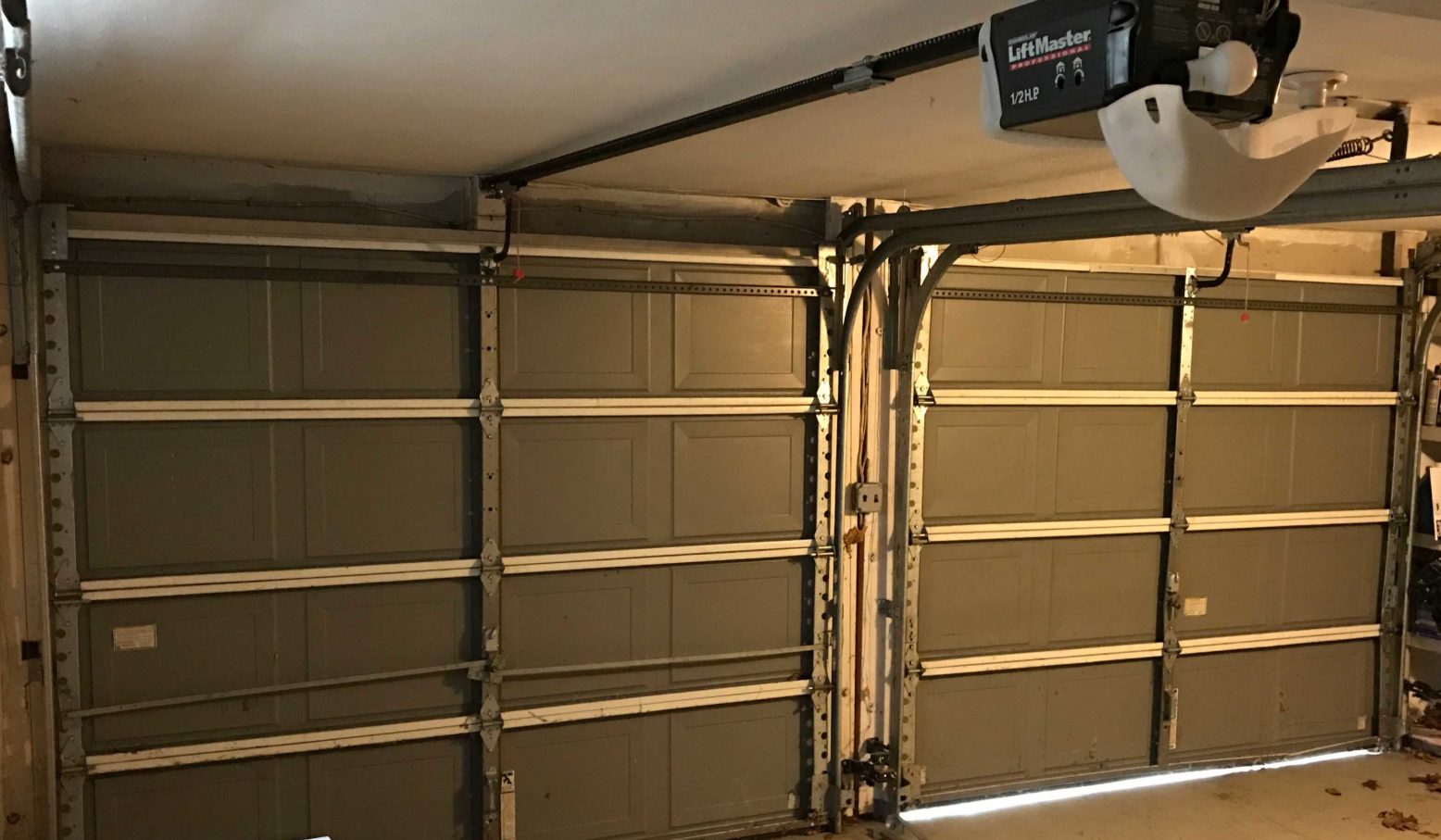 Orlando FL Quick Garage Door and Gate Repair expert technician providing residential garage door spring repair and opener service in Winter Park, Florida.